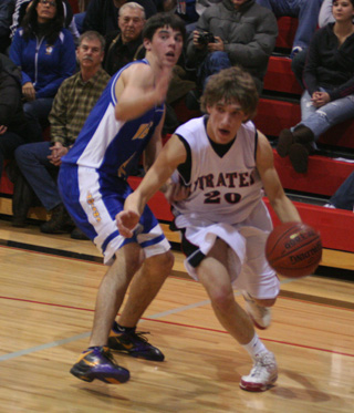 Justin Schmidt drives past Nezperces Chris Riggers during their game Monday at PHS.