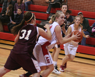 Kendal Schumacher looks to make a move past a Kamiah defender. In the background is Tanna Schlader.