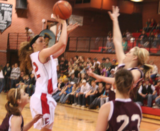 MeShel Rad puts up a jump shot over Kamiah's Shelby Cloninger.
