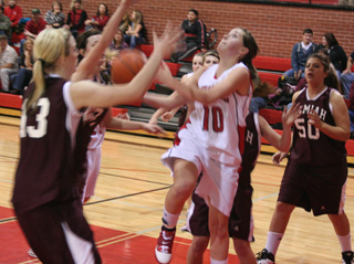 Megan Sigler tries to put up a shot inside against Kamiah.