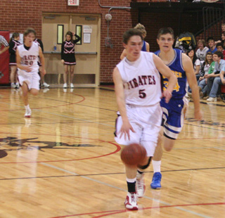 Seth Guyer heads for the hoop after a Nezperce turnover. Trailing the play is Justin Schmidt.