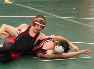 Alex Duman appears to be looking at coach Dan Altman as if to say What do I do now?