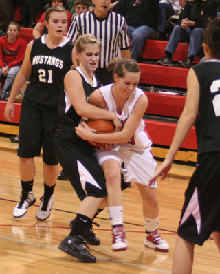 Megan Sigler and a Deary player battle for the ball. Eventually a jump ball was called.
