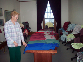 Sister Placida gets ready to deliver winter clothes.