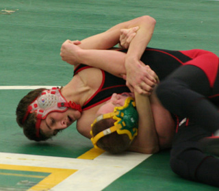 Tayler Heitman is about to pin a Potlatch wrestler.