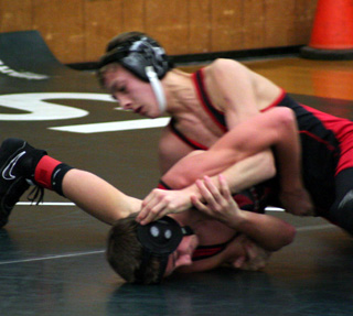 Tyler Ross rolls his opponent as he works toward a pin.