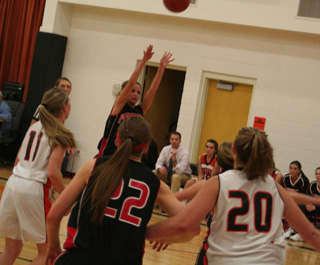 Callie Mader puts up a shot against Kendrick. #22 is MeShel Rad.