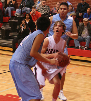 Justin Schmidt is double-teamed but still looks for an open shot.