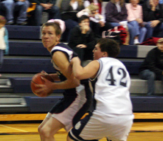 Derek Nuxoll looks to make a move to the hoop in the Summit boys game against the Grangeville JVs last Tuesday.