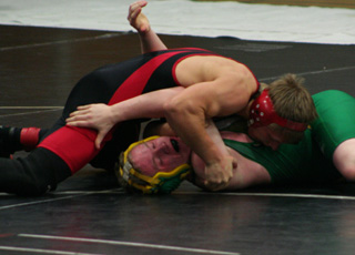 Damian McWilliams is about to pin James Amos of Potlatch. McWilliams took 2nd in the 135 lb. weight class.