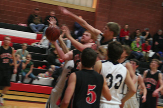David Johnson powers up a shot inside. Other Prairie players shown from left are Devin Schmidt, Seth Guyer, 5, and Beau Schlader.