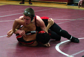 Kade Perrin turns Skylar Wilburn of Wallace who he later pinned. Perrin won the 130 lb. weight class and was named the outstanding wrestler for the 103-140 lb. weight classes.