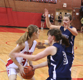 Prairies Tanna Schlader gets doubleteamed by Summits Nicole Frei , 3, and Brooke Schumacher.