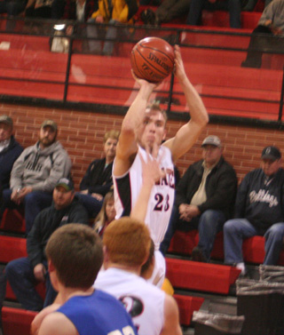 Devin Schmidt puts up an outside shot against Genesee. You can also see David Johnson's red hair.