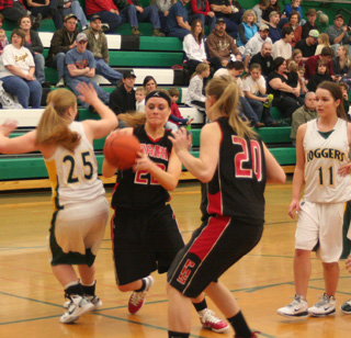 MeShel Rad juked her way past a Potlatch defender as she goes into the lane. Also shown is Kendal Schumacher.