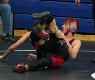 Tayler Heitman controls his opponents leg on his way to a win at the Orofino Tournament where he was on e of 5 wrestlers to finish first.