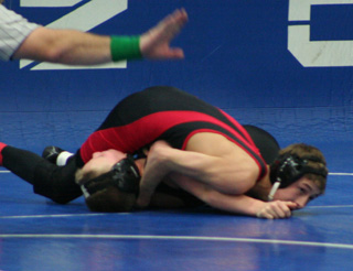 Tyler Ross is close to pinning this opponent.