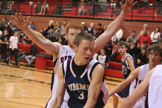 Summits Derek Nuxoll is guarded by Prairies David Johnson as Prairie puts on full-court pressure. At right is Justin Schmidt of Prairie and in the background is Summits David Waters.