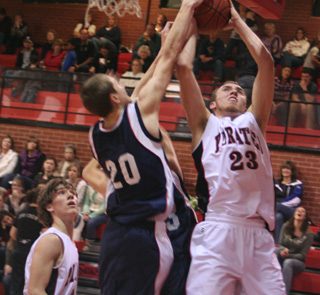 Devin Schmidt powers a shot past the check of Summits Austin Chmelik. At left is Justin Schmidt.