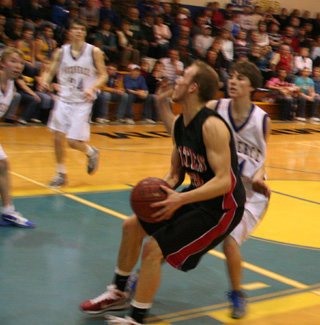 Devin Schmidt comes to a jump stop at the low block as he looks to shoot against Nezperce.