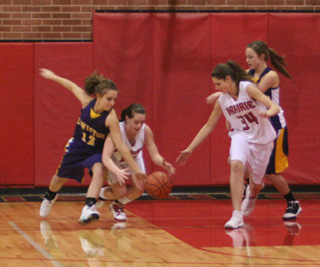 Megan Sigler and Shelby VonBargen go after a loose ball in the game against Lewiston JV.