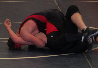 Garrett Schmidt appears to be on his way to a pin in some of his first action after a long lay-off. Photo by Donna Ross.