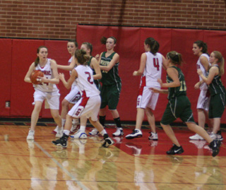 Kayla Johnson looks to pass to Callie Mader. Also shown are Taylor Heitman, Meaghan Bruner, 4, and Shelby VonBargen at far right.