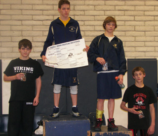 Tyler Ross, far right, with his 4th place medal at the New Plymouth Tournament. Photo by Donna Ross.