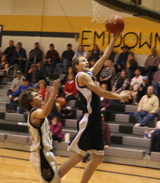 Austin Chmelik goes for a lay-up at Highland.