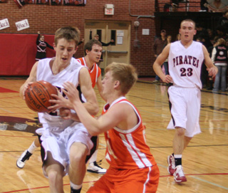 Beau Schlader penetrates into the lane as Devin Schmidt trails on the play.