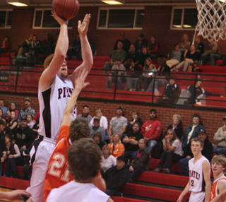 David Johnson goes up for a shot against Troy. At right is Beau Schlader and you can see the back of Justin Schmidts head.