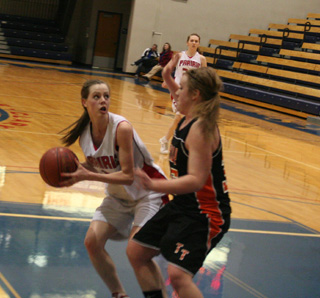 MaKayla Schaeffer looks to put up a shot in the Troy game. In the background is Kayla Johnson.