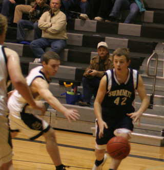 Matthew Schwartz dribbles along the baseline in Summits game at Highland last Friday.