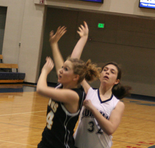 Megan Rehder watches to see if her shot goes in.