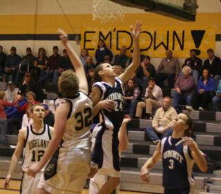 Michael Waters puts up a shot at Highland as Derek Nuxoll watches.
