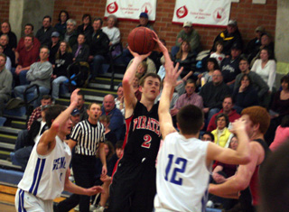 Beau Schlader puts up a shot at Genesee. at right is David Johnson.