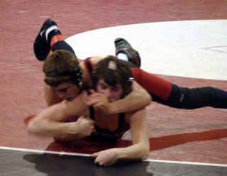 Kade Perrin looks to turn Kamiah's Ryan Simler in the home wrestling meet last Tuesday. Photo by Kayla Raymond.