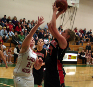 Kendall Schumacher scores the only Prairie basket of the second quarter. MeShel Rad is in the background.