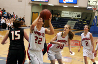 MeShel Rad pivots around a Kendrick defender for a shot as Tanna Schlader and Callie Mader look on.