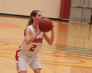 Callie Mader shoots for 3 in the Challis game.