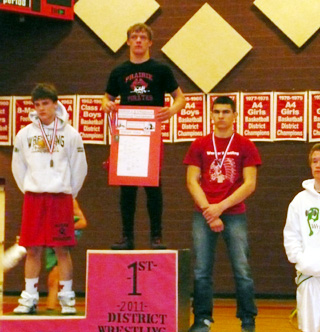 Damian McWilliams is atop the victory platform for the 135 lb. weight class. Photo by Pat McWilliams.