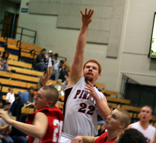 David Johnson puts up a 1-hander inside the lane against C.V. at District.