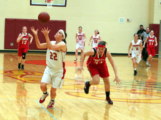 MeShel Rad catches a long pass from a teammate in the Challis game. In the background are MaKayla Schaeffer, Megan Sigler and Callie Mader.