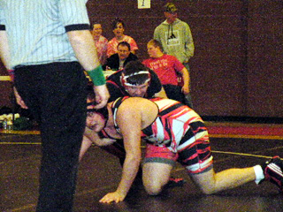 Mitch Jungert takes control of Wallaces Brandon Wilbrun in the semifinals. Photo by Joe Ross.