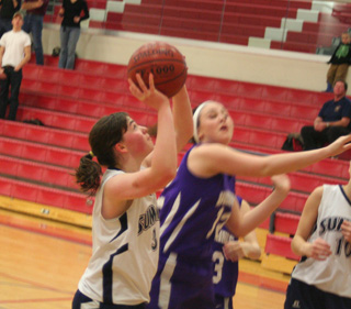 Nicole Frei scores a lay-up against Garden Valley. At right is Sarah Chmelik.