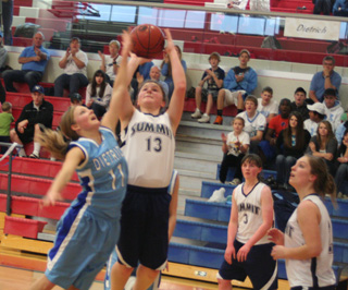 Rachel Wemhoff puts up a shot in the Dietrich game. At right are Nicole Frei and Jamie Chmelik.