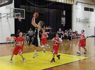 Rhett Schlader takes the ball to the hoop on a fast break.