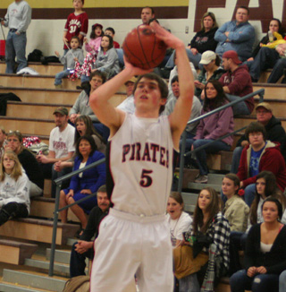 Seth Guyer puts up an outside shot against Shoshone. His 3-pointer late in the game sent it into overtime.