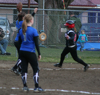 Kendra Dinning rounds third during her 3-run homer at Orofino.