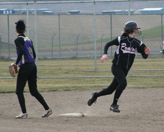 Tanna Schlader rounds second on a triple in the first Kellogg game.